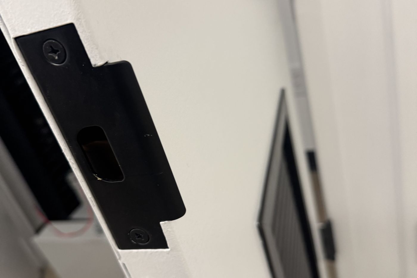 Electric strike installed in a commercial door frame