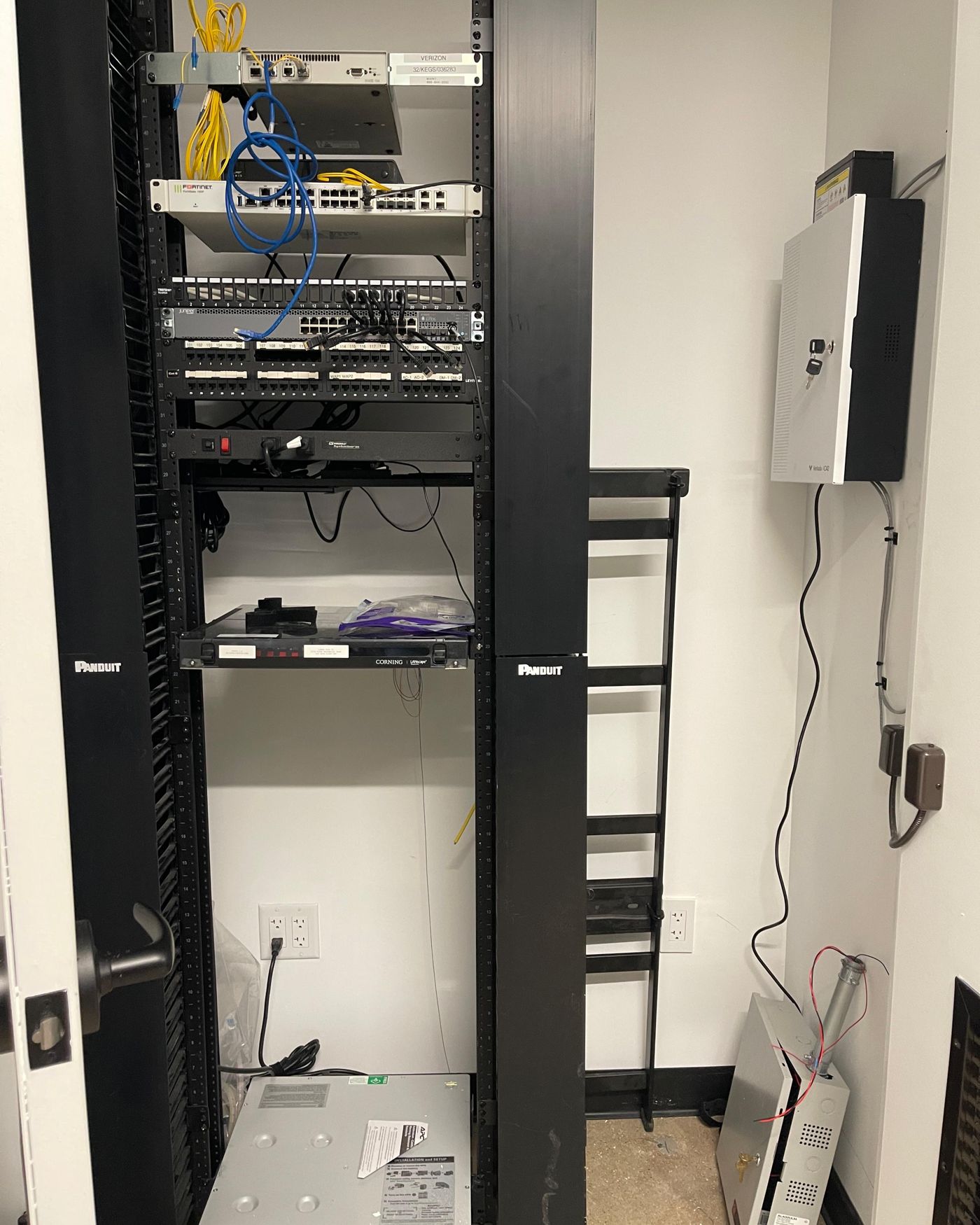 Neatly wired equipment rack in a building utility closet